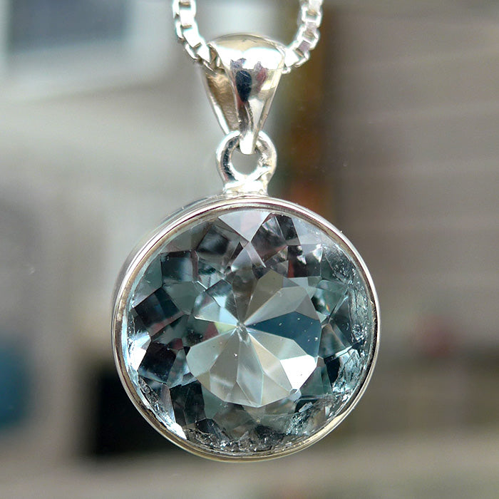 Round Untreated Bezel Set Blue Topaz Pendant