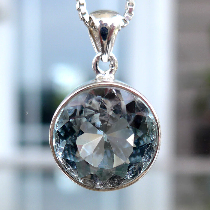 Round Untreated Bezel Set Blue Topaz Pendant