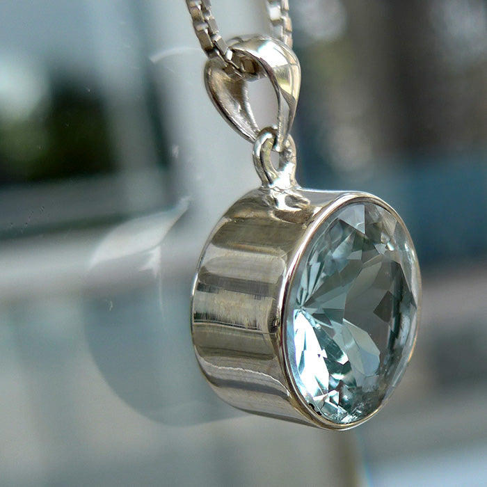 Round Untreated Bezel Set Blue Topaz Pendant