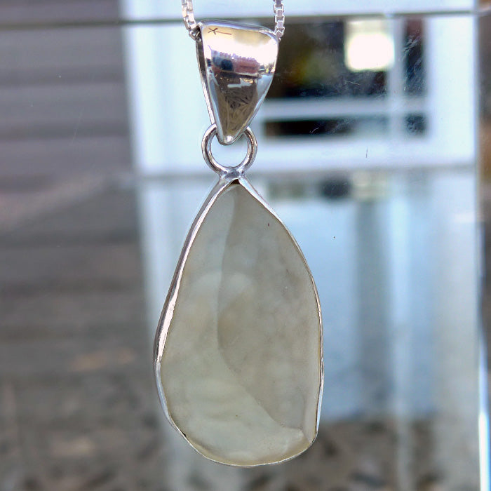 Curving Libyan Desert Glass Teardrop Pendant