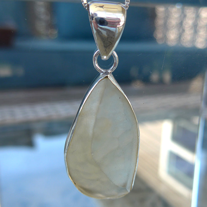 Curving Libyan Desert Glass Teardrop Pendant