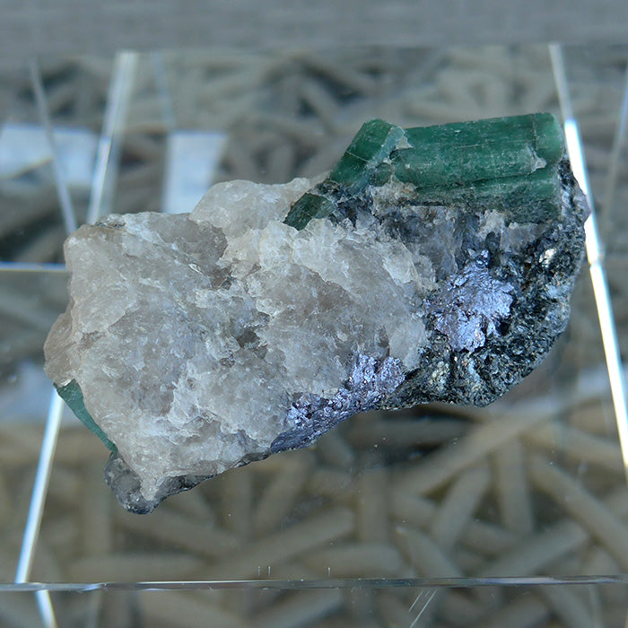 Emerald Rod on Matrix with Hematite