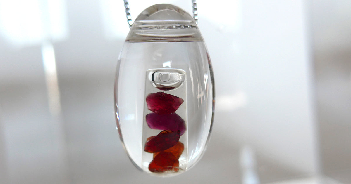 Multi Hued Anthill Pyrope Garnet in Quartz Waterdrop Pendant by Brian Cook