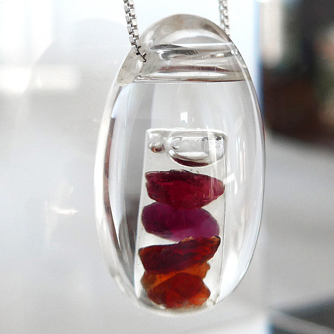 Multi Hued Anthill Pyrope Garnet in Quartz Waterdrop Pendant by Brian Cook