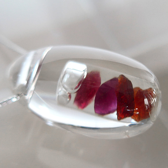 Multi Hued Anthill Pyrope Garnet in Quartz Waterdrop Pendant by Brian Cook