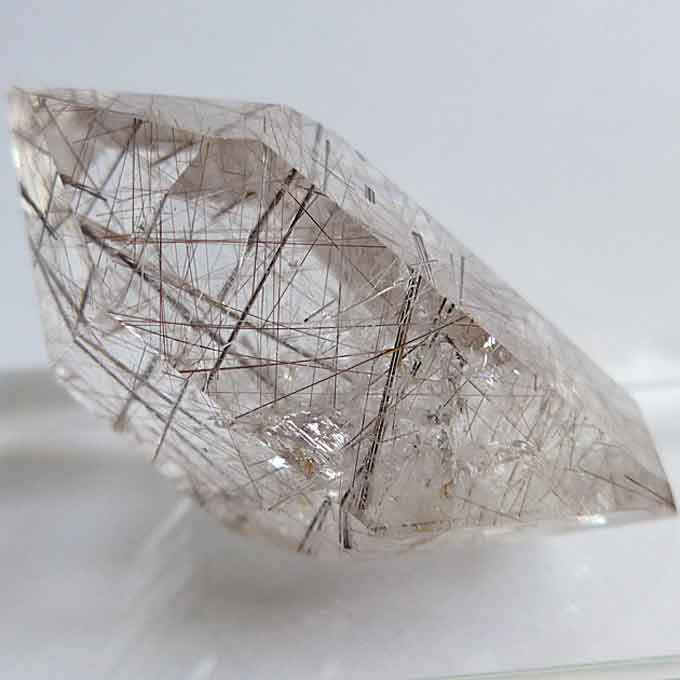 Polished Reclining Silver and Brass Rutile Point